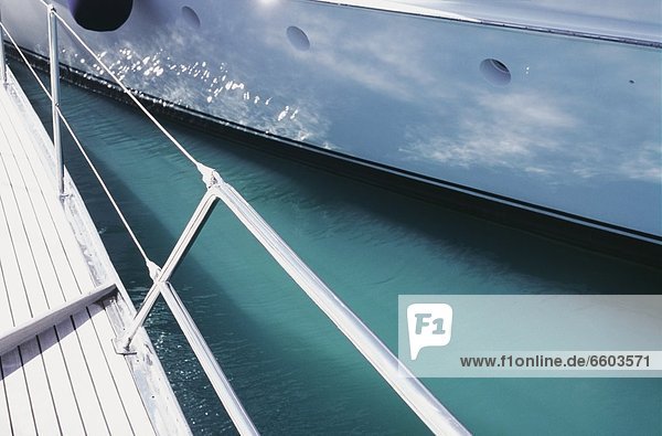 Sailing Boat Deck With Reflection Of Ocean On Boat