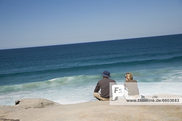 Couple Looking Out Over Mackensies Point Near Bondi Beach