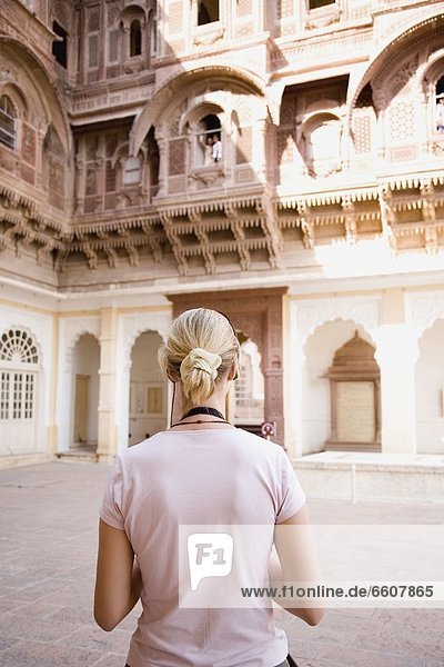 Blond Tourist Looking At Building In Fort Mehrangarh