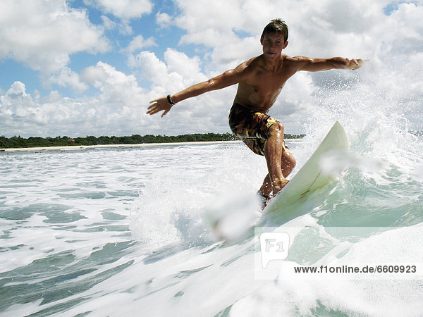 Surfer Balancing On Board  Low Angle View