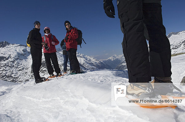 People snowshoeing at Grimsel Pass  Goms Valley southwest Switzerland