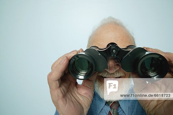 Senior Looks Through Binoculars