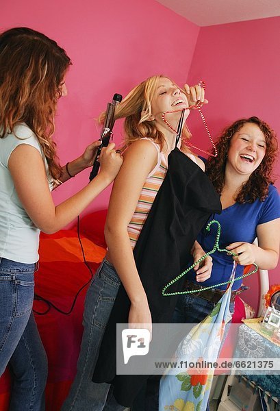 Teenagers Getting Ready To Go Out