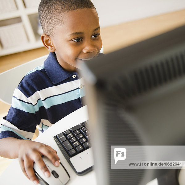 Black boy using computer