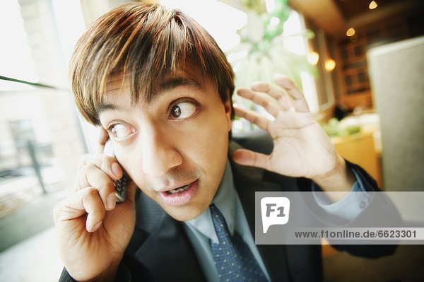 Man Listening On Cell Phone