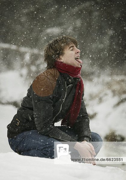 Young Man Tasting Snow