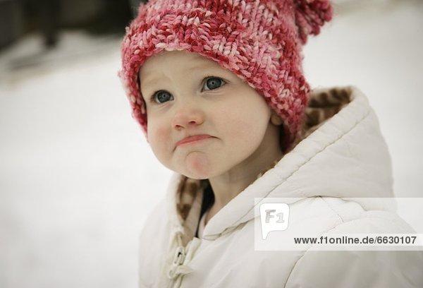 Little Girl Outside In The Snow