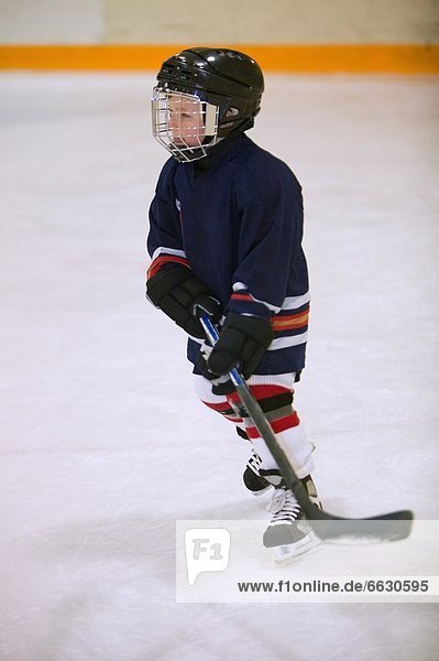Child Playing Hockey