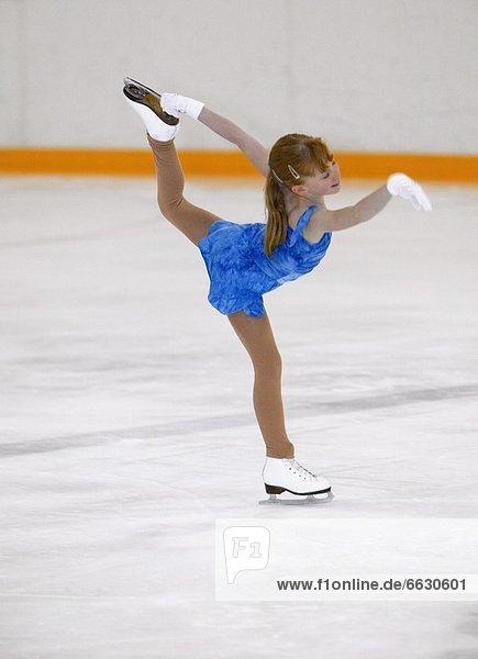 A Young Girl Figure Skating