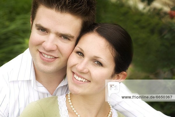 Image Of Couple Smiling And Having Their Photo Taken