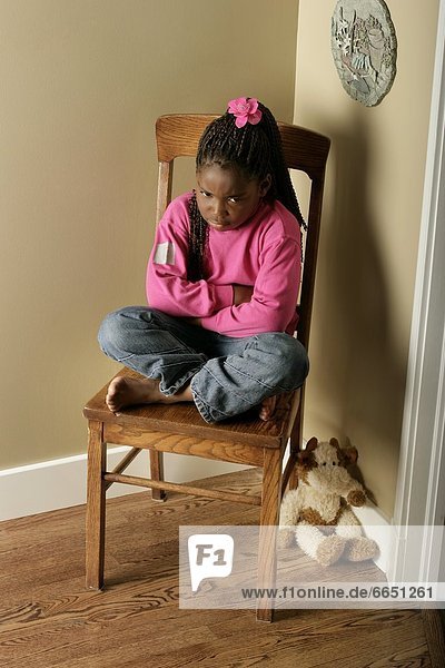 Girl On Chair In The Corner