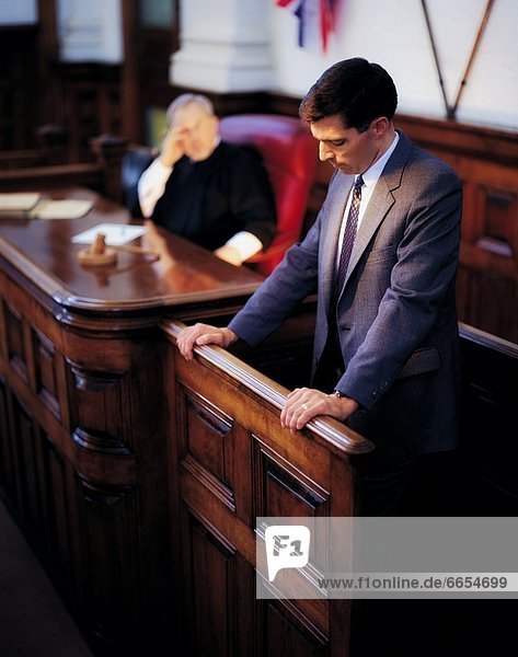 A Man On The Witness Stand In A Courtroom