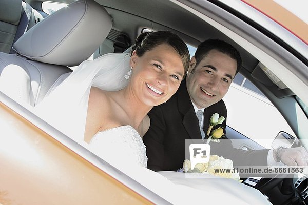 Bride And Groom In The Car
