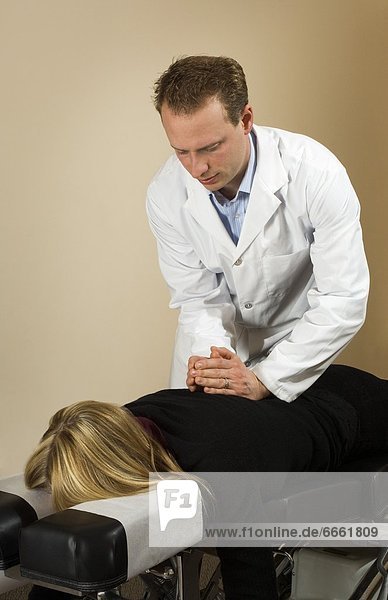Chiropractor With His Patient