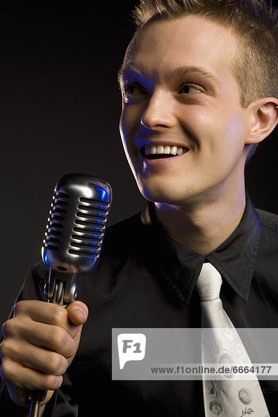 Young Man With A Microphone