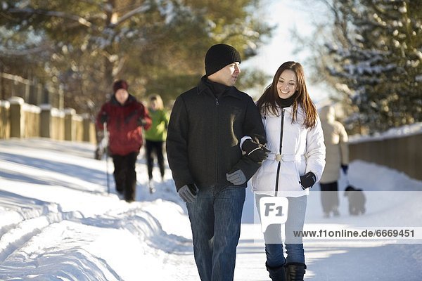 Couple Walking On Winter Paths  Edmonton  Alberta  Canada