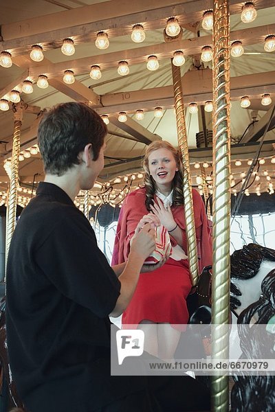 Man And Woman On Carousel