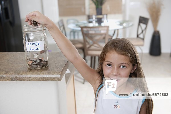 A Young Girl Saving Up For Her College Fund