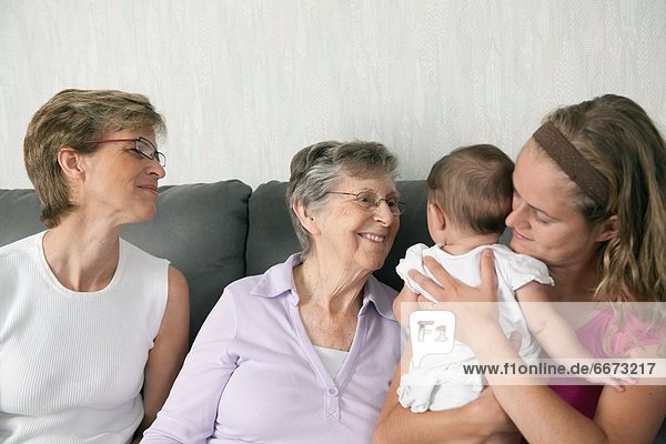 Four Generations Of Females Spending Time Together