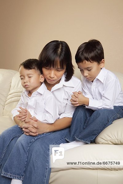 Mother Praying With Her Sons