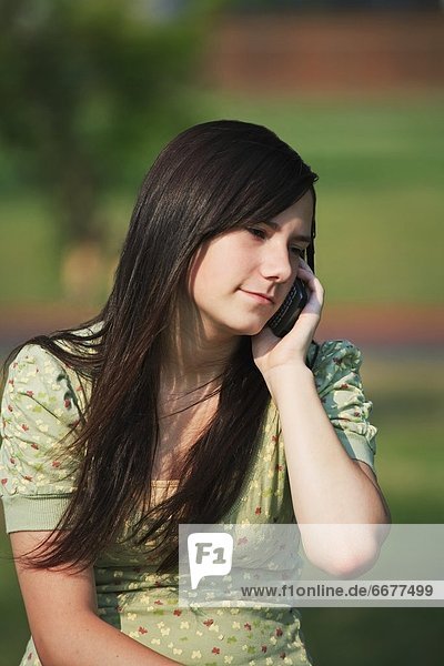 A Girl Talking On Her Cell Phone