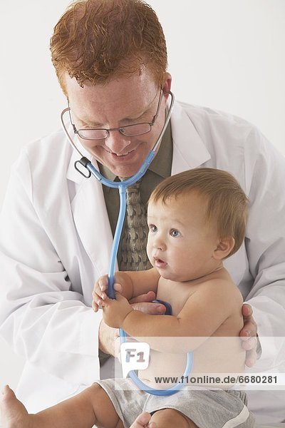 A Pediatrician Examining A Baby