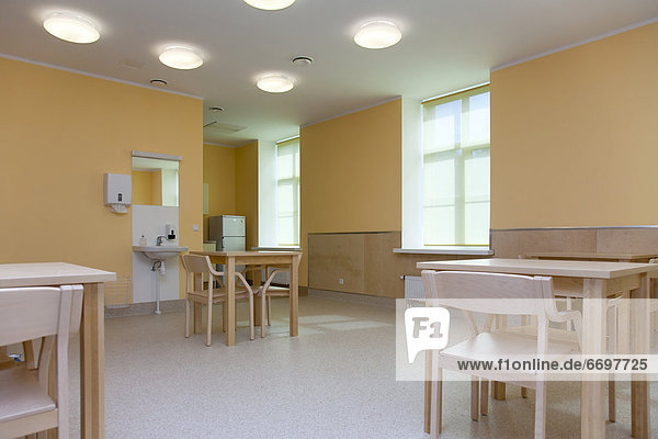Hospital Room With Tables and Chairs