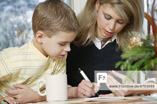 Mother Son Working At Table