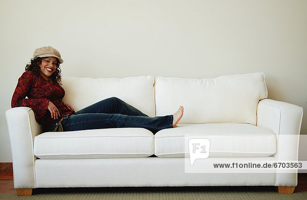 Woman Relaxes On Sofa