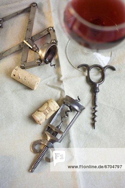 Still life of corkscrews and wine