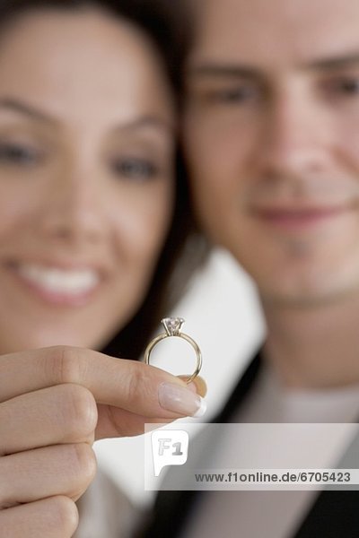 Closeup of blurred couple with ring