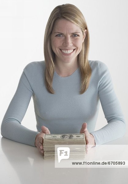 Woman with a stack of money