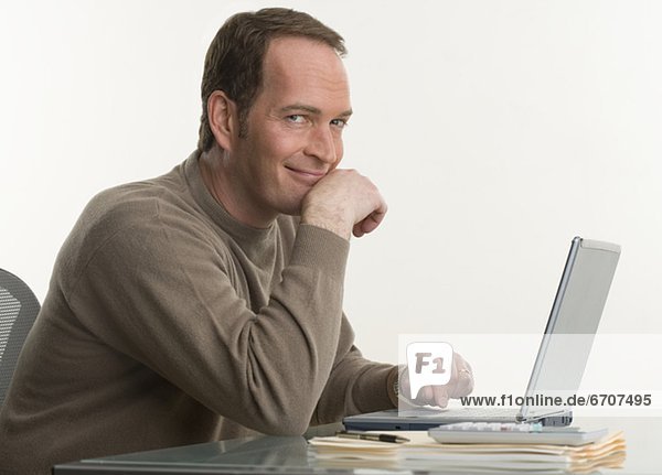 Portrait of a man at his computer