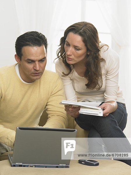 Couple working together at computer