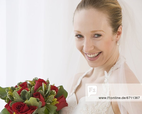 Close up of bride holding bouquet