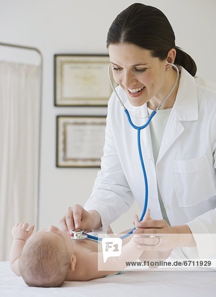 Frau Doktor examining baby