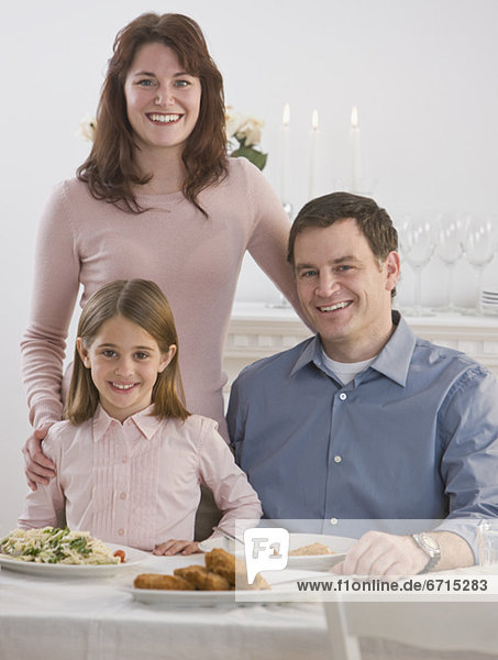 Portrait of family at dinner table