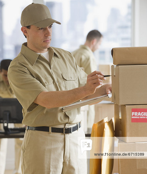 Delivery man making package