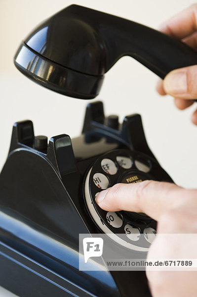 Hand dialing rotary telephone
