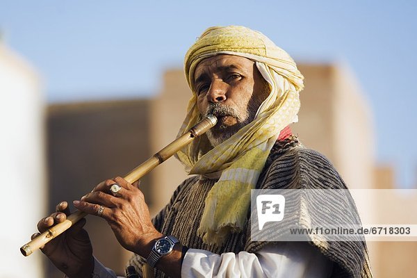 Portrait Of Man Playing Flute In Essaouira  Morocco