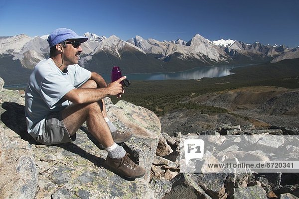 Male Hiker Resting With Water Bottle  Jasper National Park  Alberta  Canada