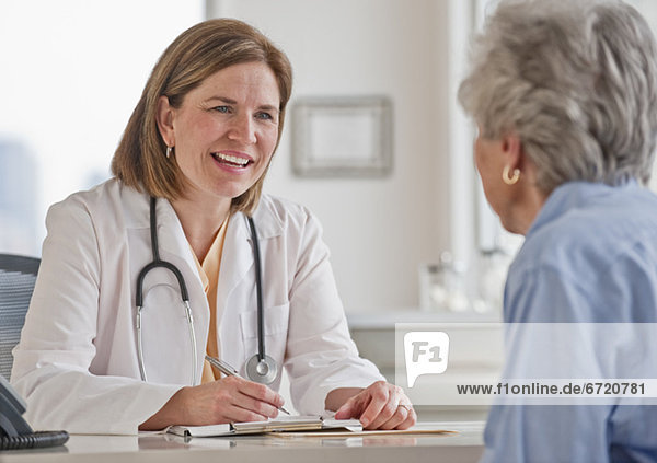 Senior woman talking with female doctor