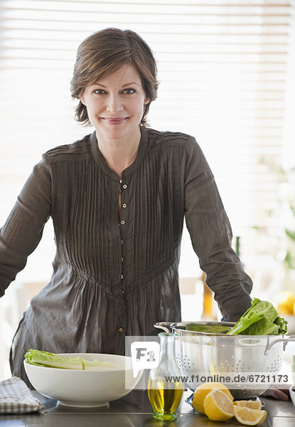 Woman preparing food in kitchen  portrait