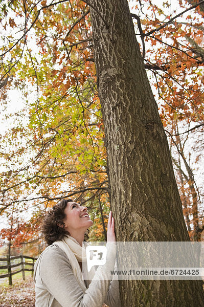 Woman looking at tree