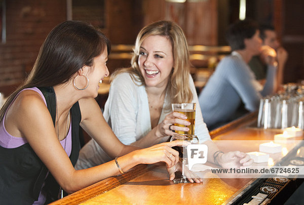 Friends drinking at bar
