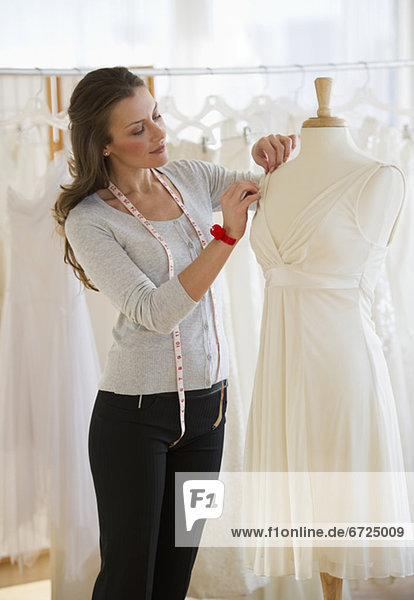 Seamstress in bridal shop