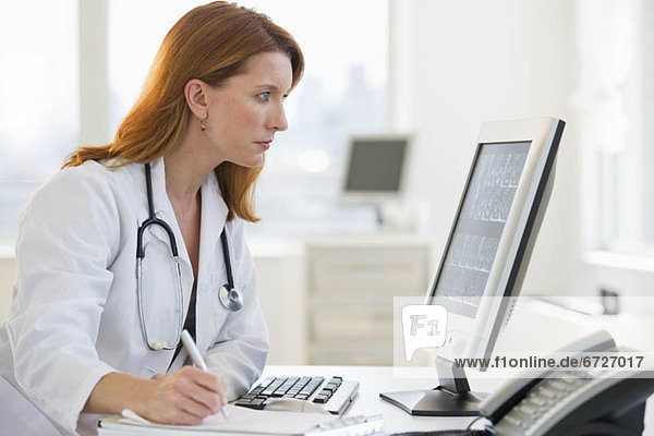 Doctor working at computer