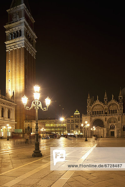 'St. Mark's Square And St. Mark's Basilica And Bell Tower At Night