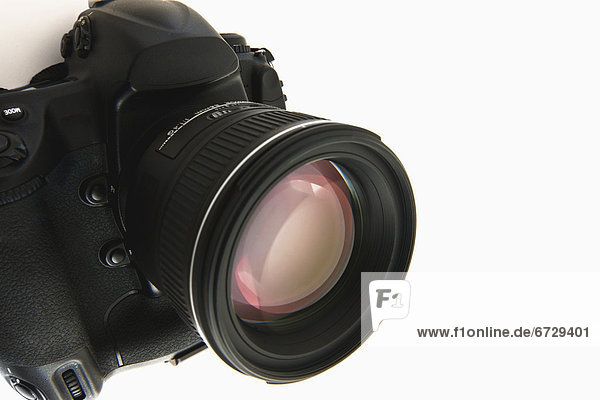 Close up of camera lens on white background