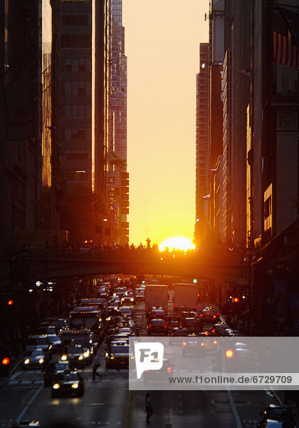 USA  New York  New York City  Sunset illuminating busy street